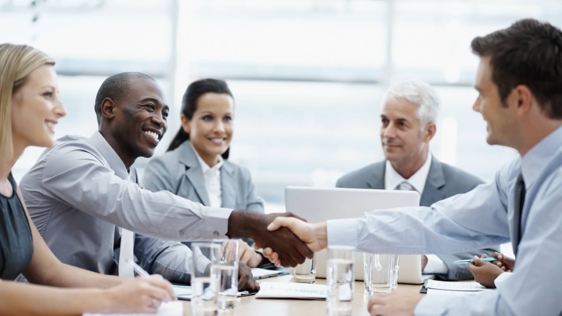 Two men shaking hands in a business meeting