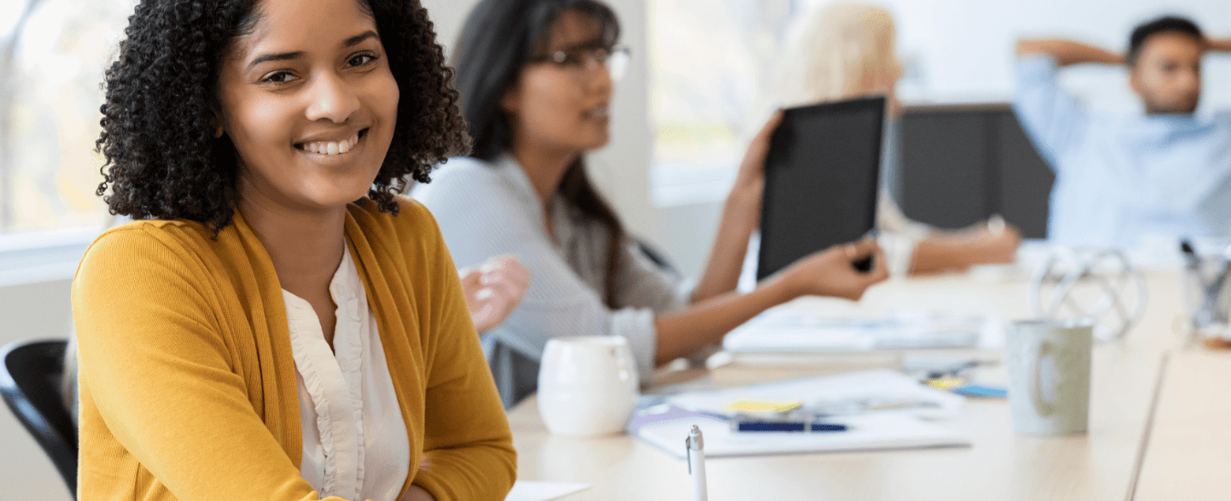 Woman smiling in a business meeting